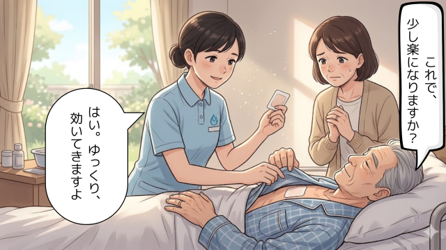 訪問看護師がフェンタニルテープを貼った後、妻がそばで見守る在宅医療の様子